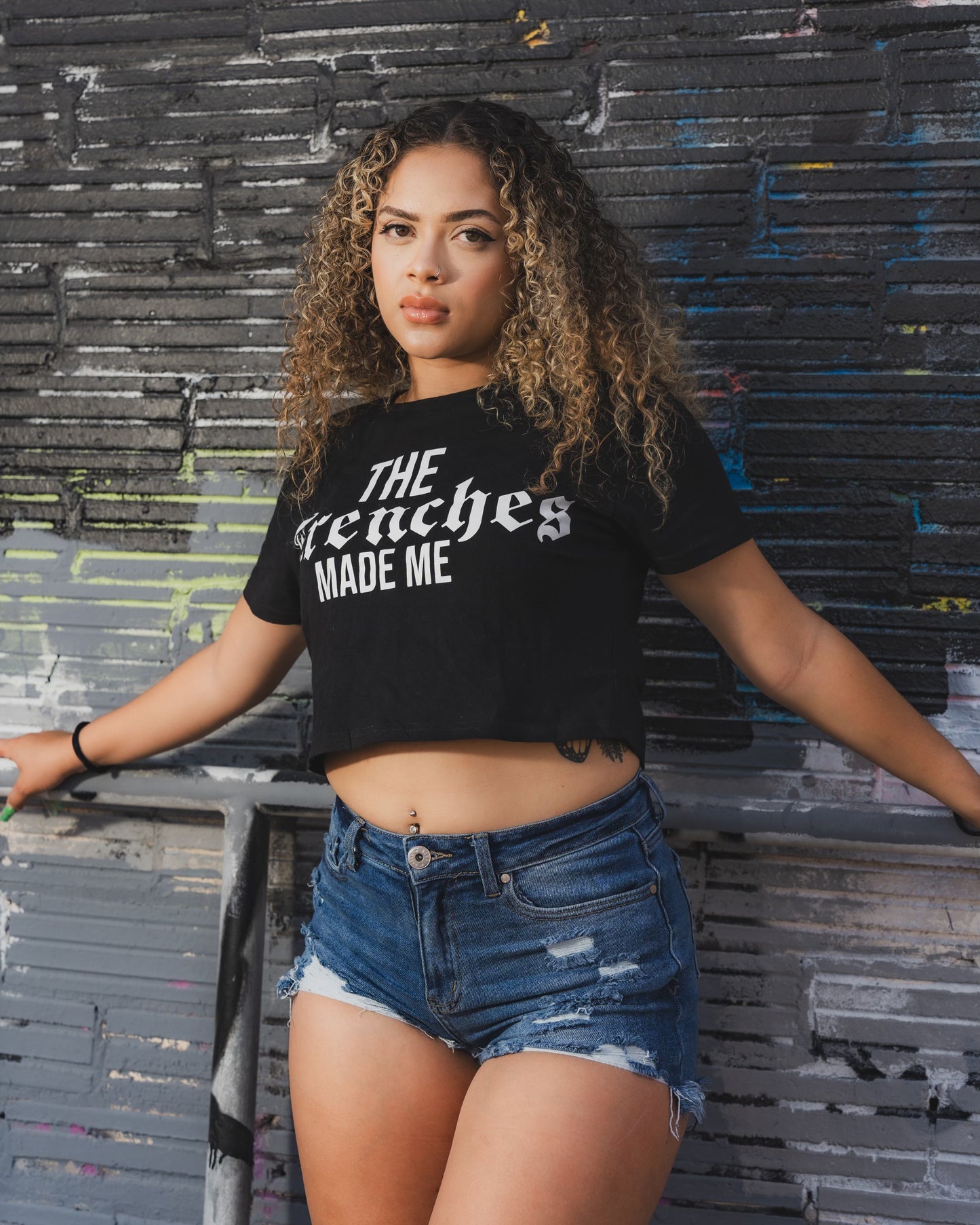 Ladies “The Trenches Made Me” Logo Crop Top